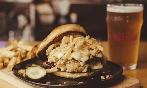Old Chicago Pizza + Taproom marks 50 years with the Cinco Cero tour, a new burger and milestone rewards